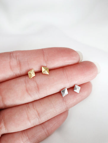 diamond pyramid studs in hand