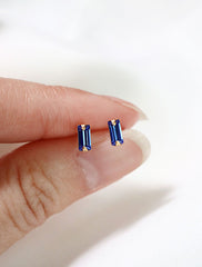 micro sapphire baguette stud earrings in hand, september birthstone