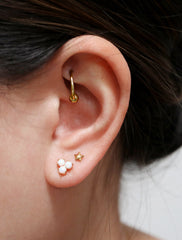 opal trefoil stud earrings modelled