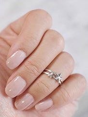 stacked large and small star midi rings