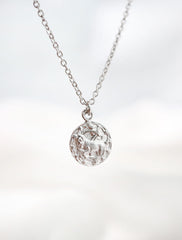 silver horoscope necklace hanging