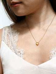 gold seashell necklace modelled
