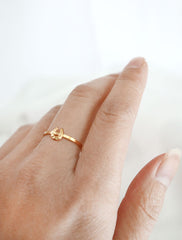 gold horseshoe ring worn