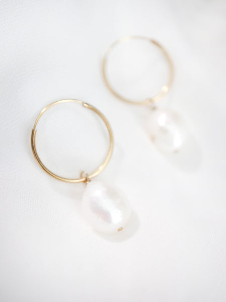 close up of baroque pearl hoops