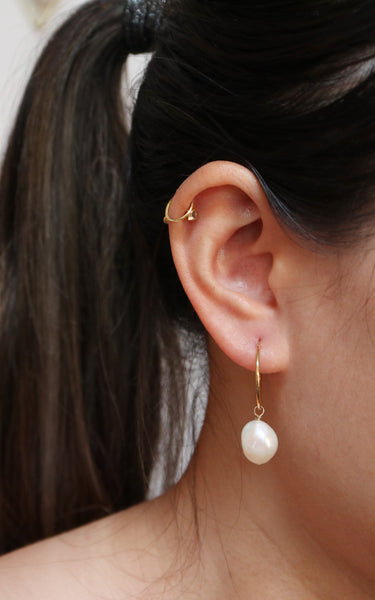 baroque pearl hoop earrings modelled