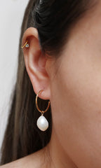 baroque pearl hoops modelled side view