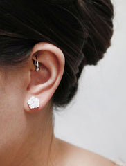 carved pearl flower earrings modelled
