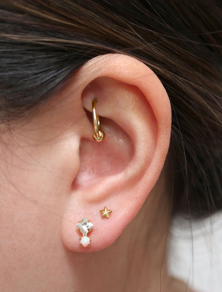 crystal and opal stud earrings modelled
