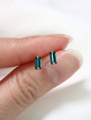 micro zircon baguette earrings in hand, december birthstone