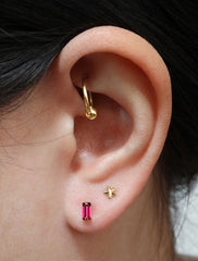 micro garnet baguette earrings modelled, january birthstone