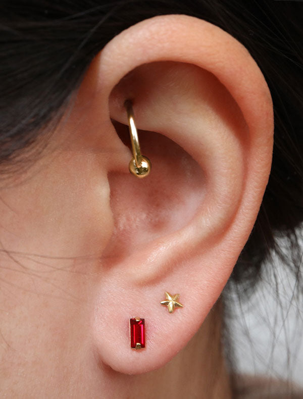 micro ruby baguette earrings modelled, july birthstone