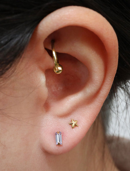 micro alexandrite baguette earrings modelled, june birthstone