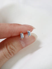 micro alexandrite baguette earrings in hand, june birthstone