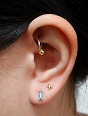 micro aquamarine baguette earrings modelled, march birthstone