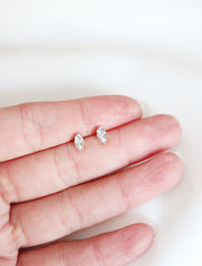micro marquis stud earrings in hand
