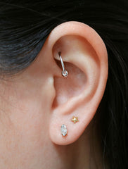micro marquis stud earrings modelled