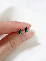 micro emerald baguette studs in hand, may birthstone
