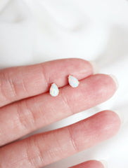 micro opal teardrop earring studs in hand