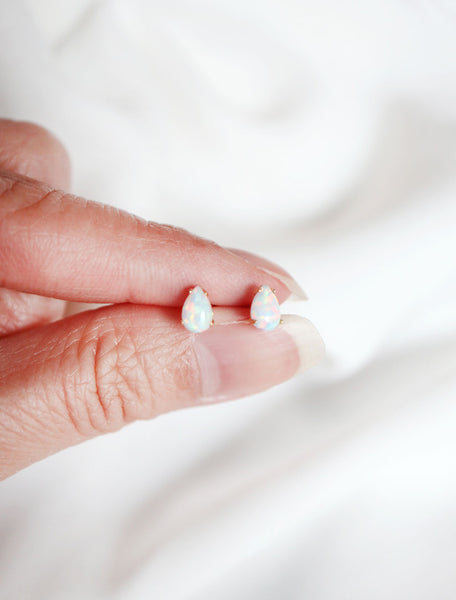 micro teardrop opal earring studs in hand