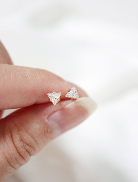 micro cubic zirconia stud earrings in hand