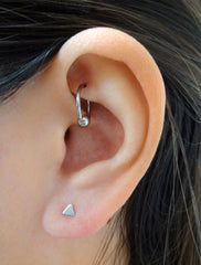 tiny silver triangle studs modelled