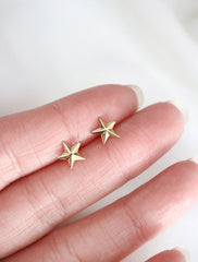 gold filled star stud earrings in hand