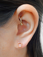 open square stud earrings modelled