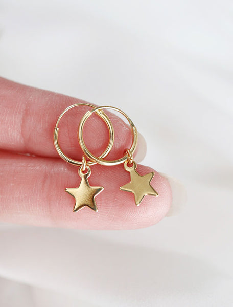 gold vermeil star charm hoops in hand