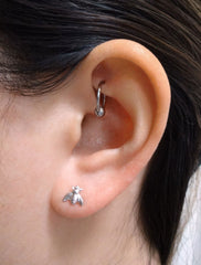 tiny silver bee stud earrings modelled