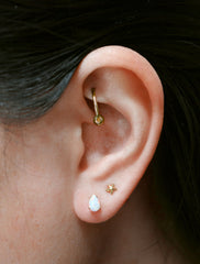 micro opal teardrop earrings modelled