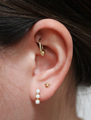 triple opal bar stud earrings modelled