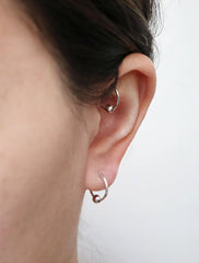 small sterling silver huggie hoop earrings with bead modelled
