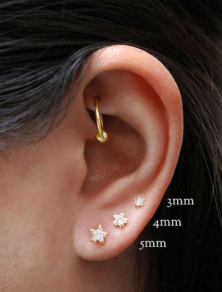 sterling silver and vermeil star stud earrings modelled with text labels