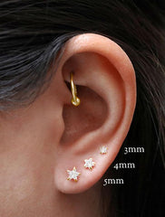 sterling silver and vermeil star stud earrings modelled with text labels