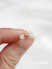 tiny crystal star stud earrings (4mm) in hand