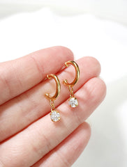 cubic zirconia charm hoop stud earrings in hand