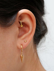 gold vermeil spike hoop earrings modelled