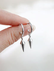 sterling silver spike hoop earrings in hand