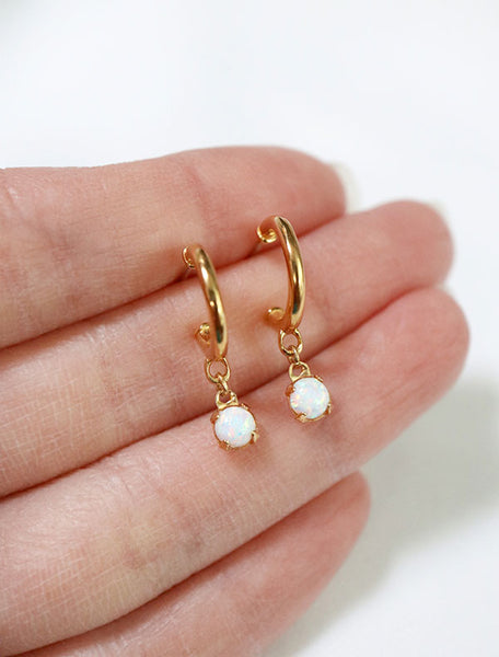 opal charm hoop stud earrings in hand