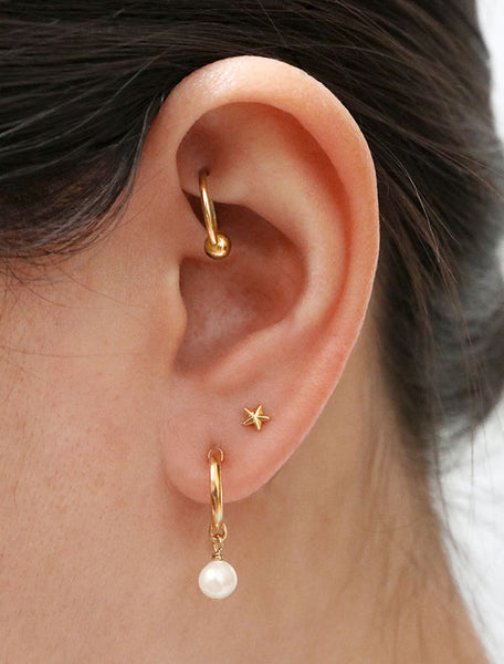 gold pearl charm hoop earrings modelled