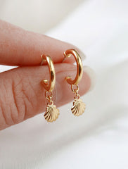 gold vermeil seashell charm hoop earrings in hand