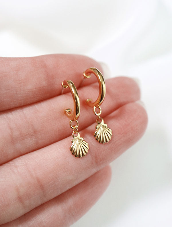 gold vermeil seashell charm hoop earrings in hand