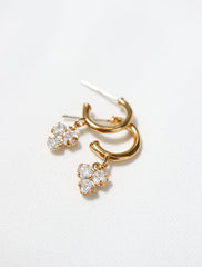 trefoil charm hoop stud earrings close up