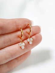 trefoil charm hoop stud earrings in hand