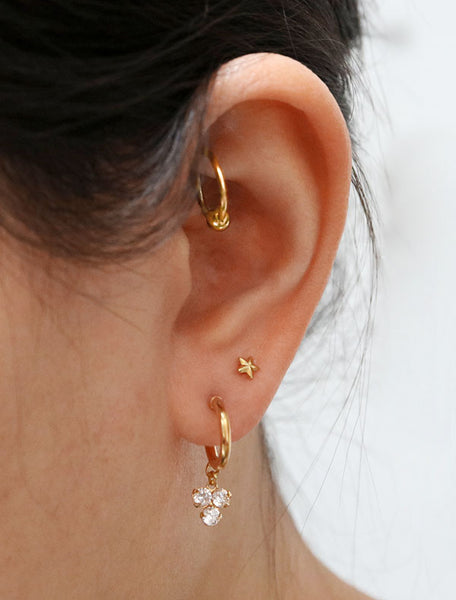 trefoil charm hoop stud earrings modelled side view