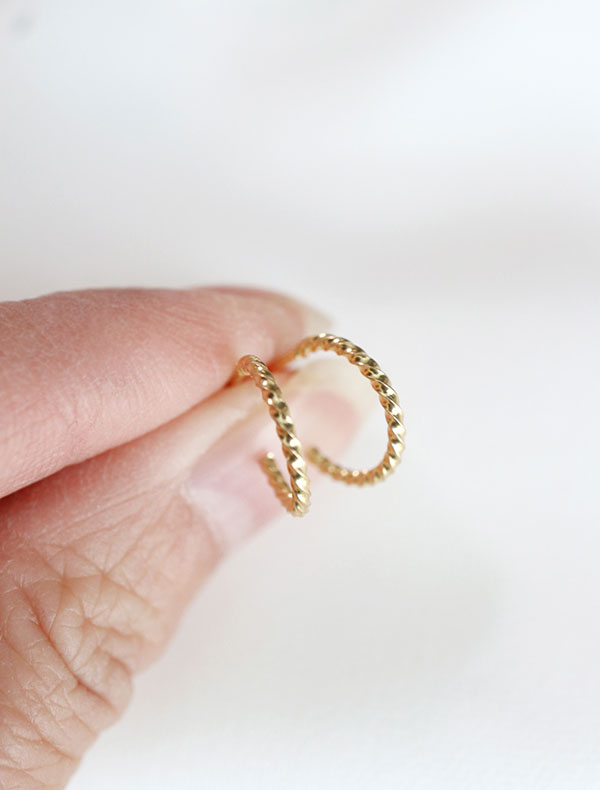 gold vermeil twisted hoop earrings in hand