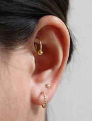vermeil twisted hoop earrings modelled
