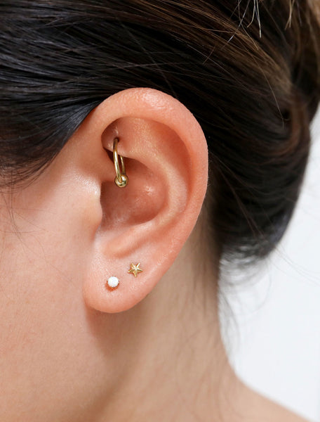tiny opal stud earrings modelled