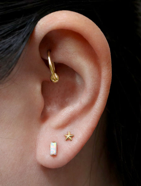 tiny gold filled opal baguette earrings modelled
