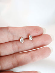 micro crystal pear studs in hand